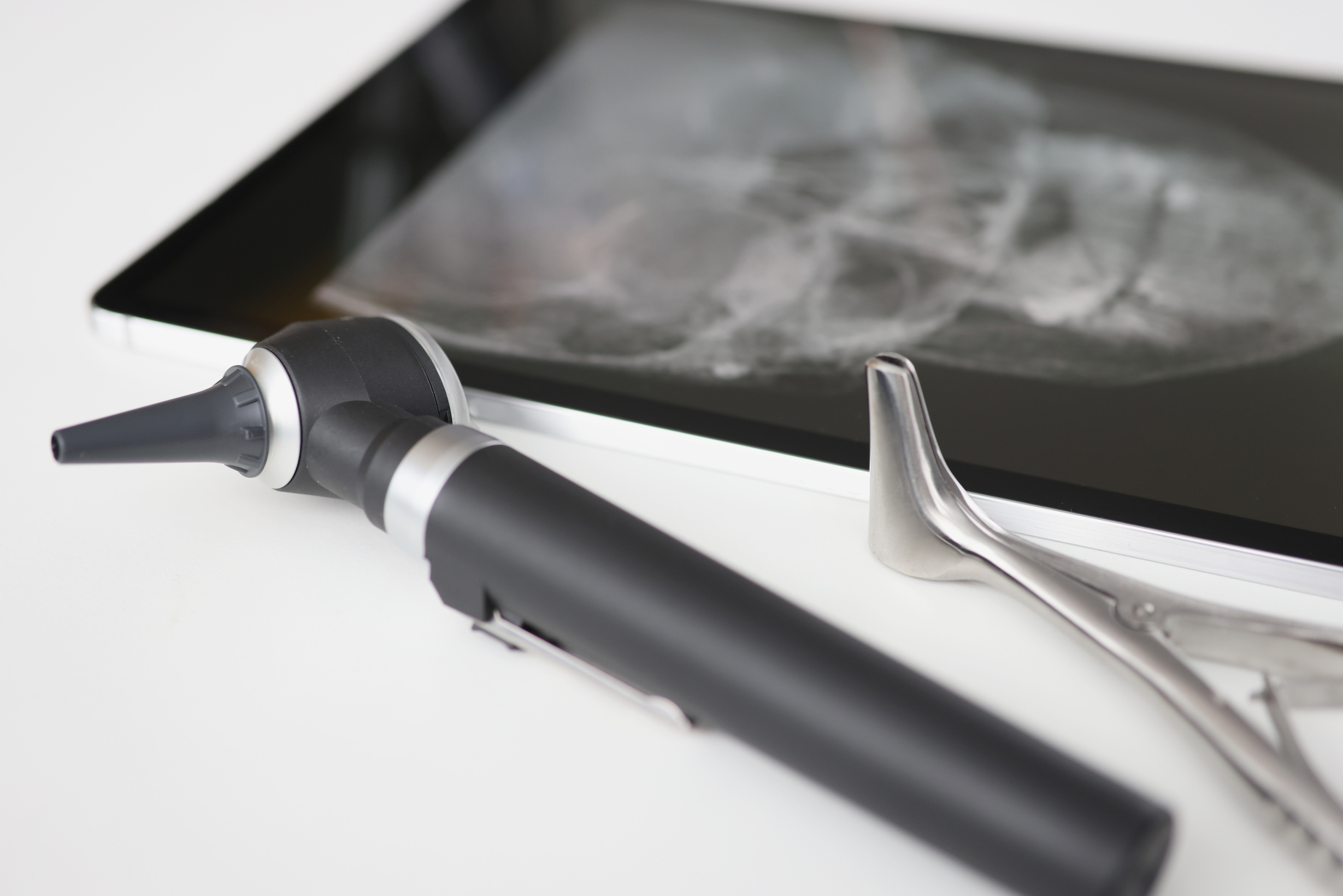 An Otoscope with an -Ray Is on Table