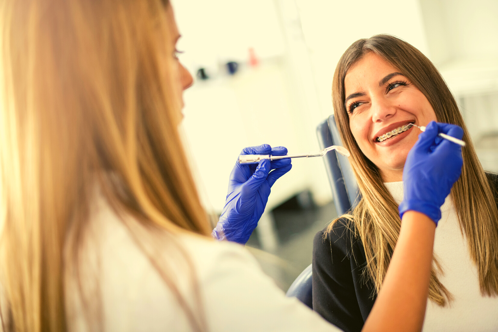 Young happy  patient a with orthodontic braces
